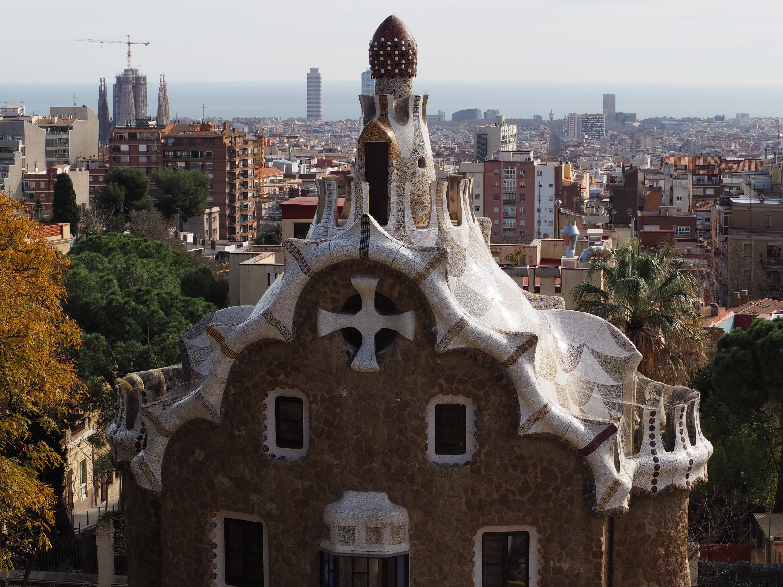 The Guard House by Gaudi at the Park Guell, and Barcelona skyline at the background