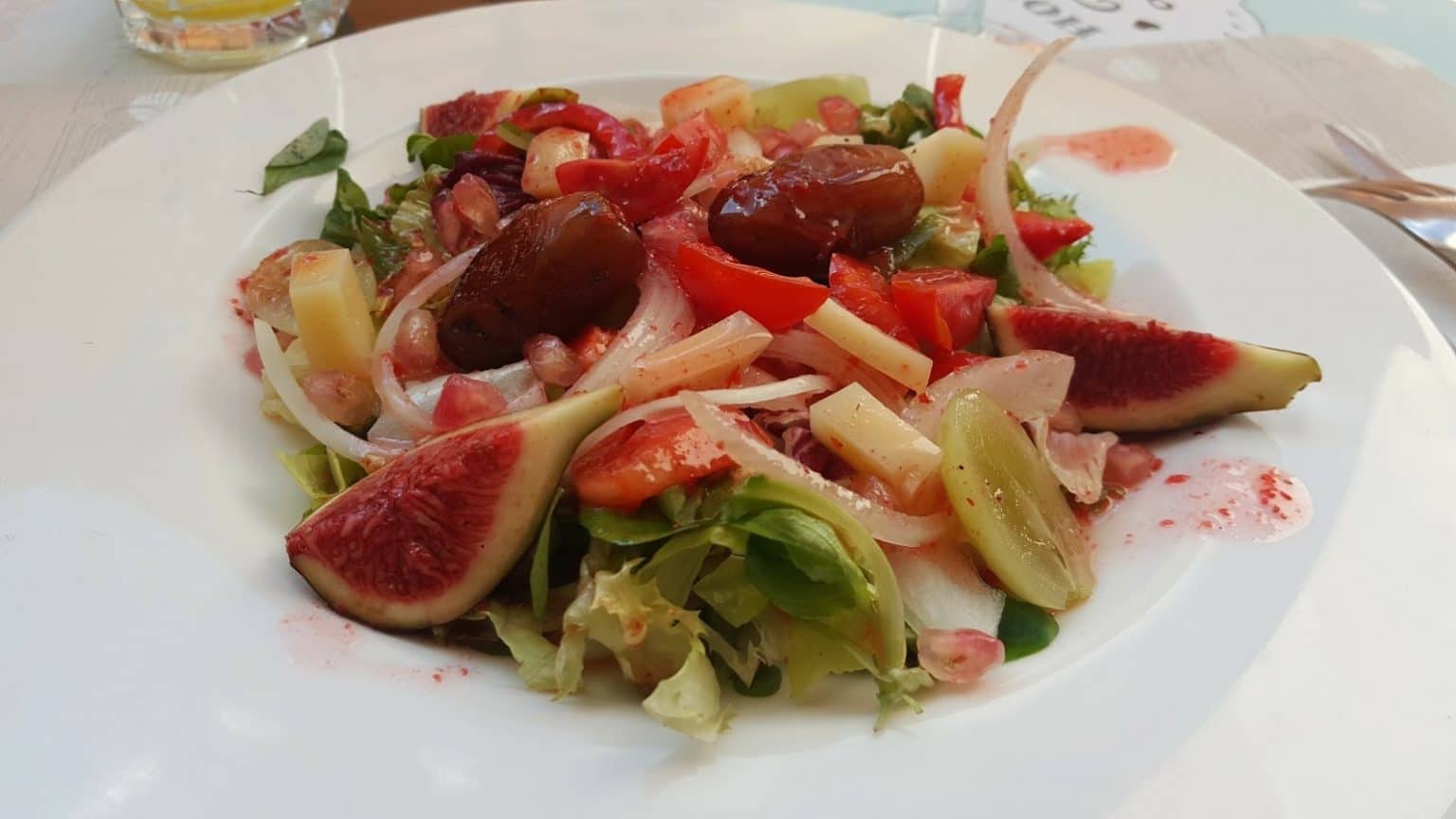 A fresh salad with fruits. Mediterranean diet. Barcelona food tour.