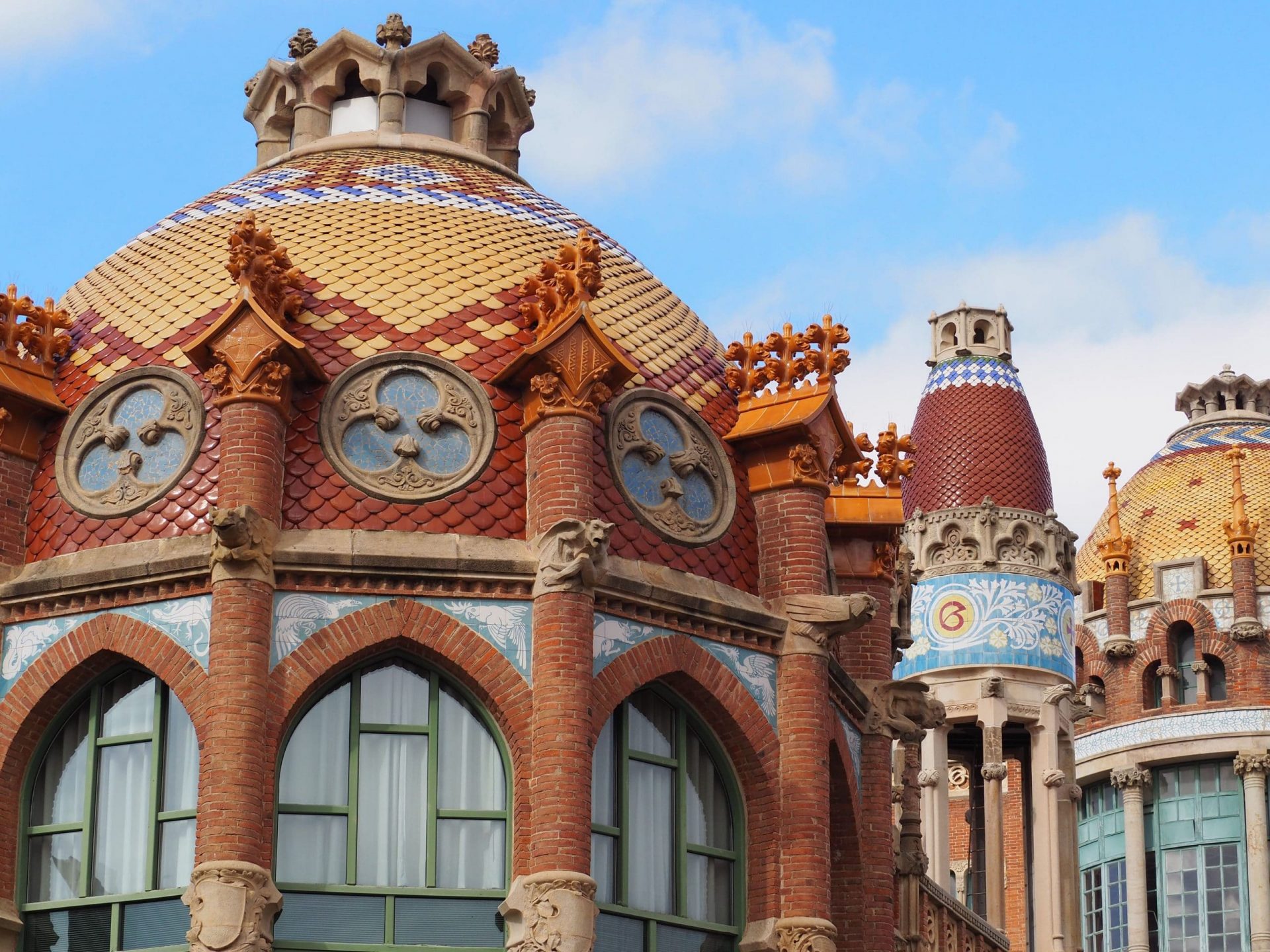 Beautiful modernist building in red brick and colored ceramics.